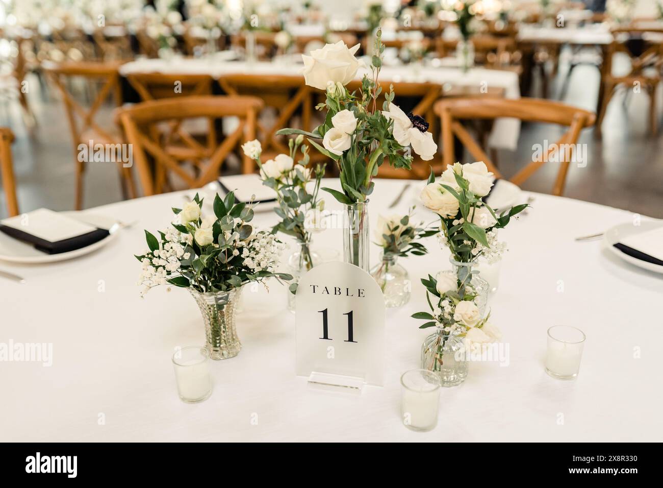 Reception table setting with numbered centerpiece Stock Photo