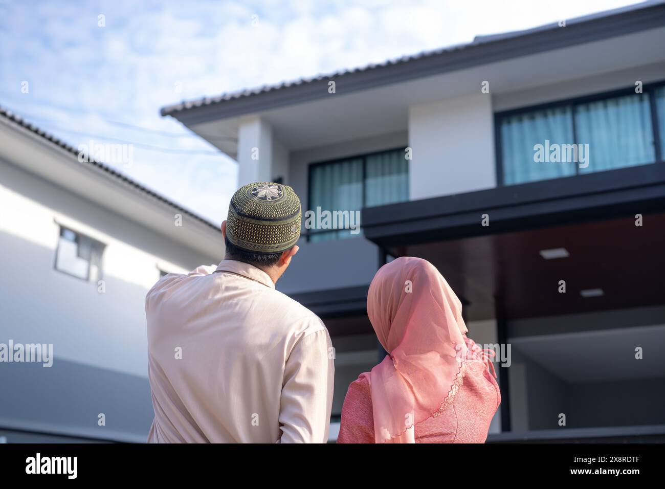 Young couple looking at their new house Stock Photo