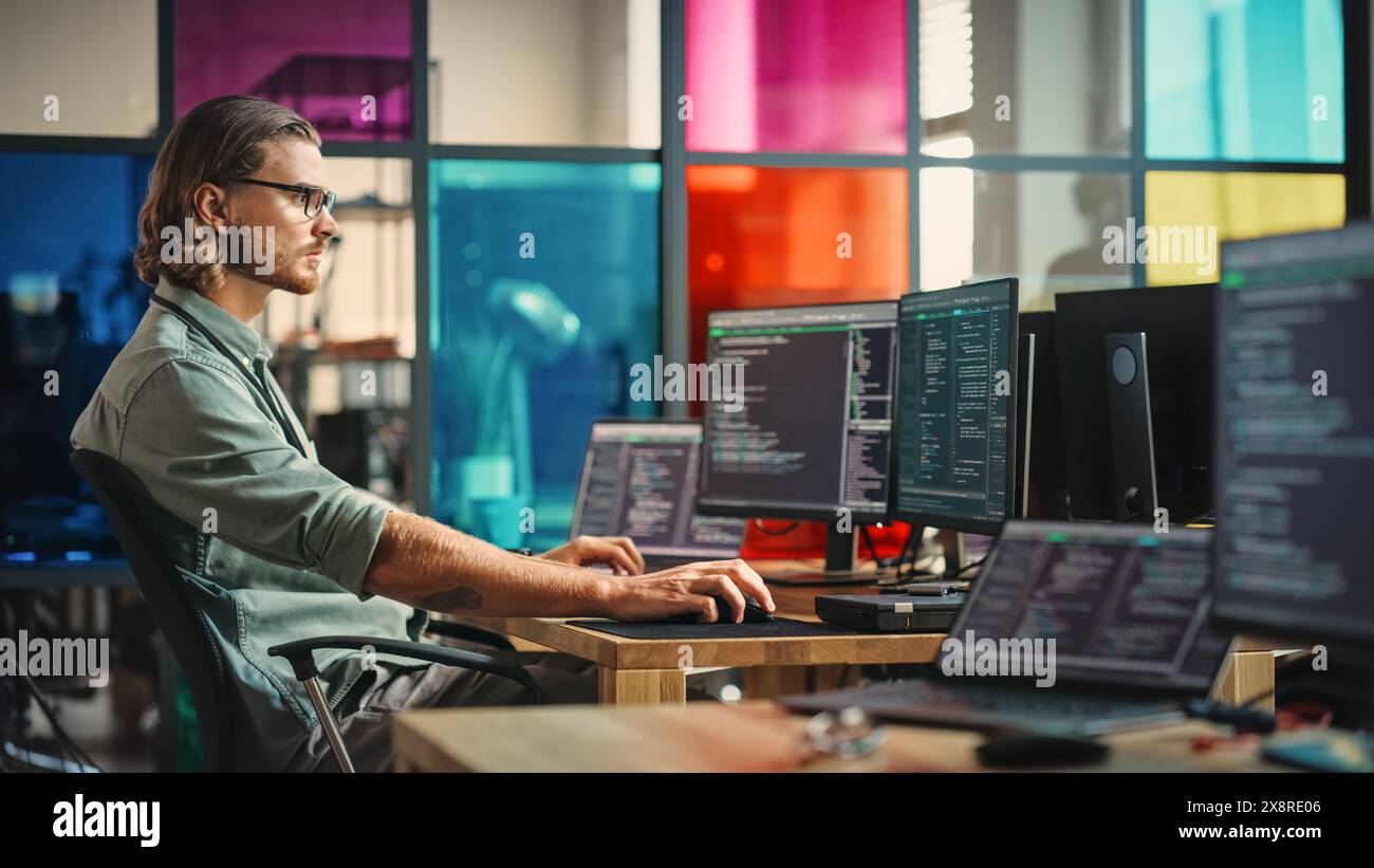 Professional Male Programmer Writing Code on Desktop Computer With ...