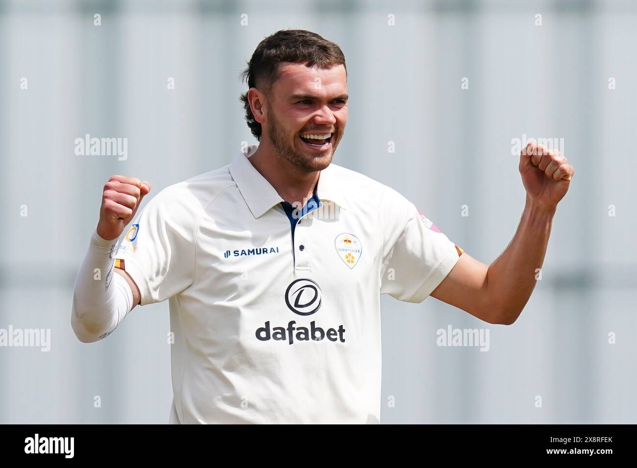 Bristol, UK, 27 May 2024. Derbyshire's Sam Conners celebrates taking the wicket of Gloucestershire's Graeme van Buuren during the Vitality County Championship match between Gloucestershire and Derbyshire. Credit: Robbie Stephenson/Gloucestershire Cricket/Alamy Live News Stock Photo