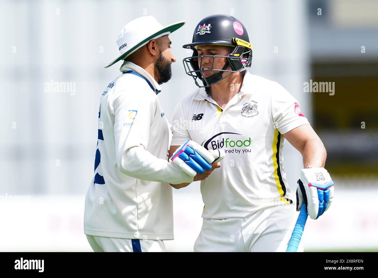 Bristol, UK, 27 May 2024. Gloucestershire's Graeme van Buuren shakes hands with Derbyshire's Anuj Dal during the Vitality County Championship match between Gloucestershire and Derbyshire. Credit: Robbie Stephenson/Gloucestershire Cricket/Alamy Live News Stock Photo