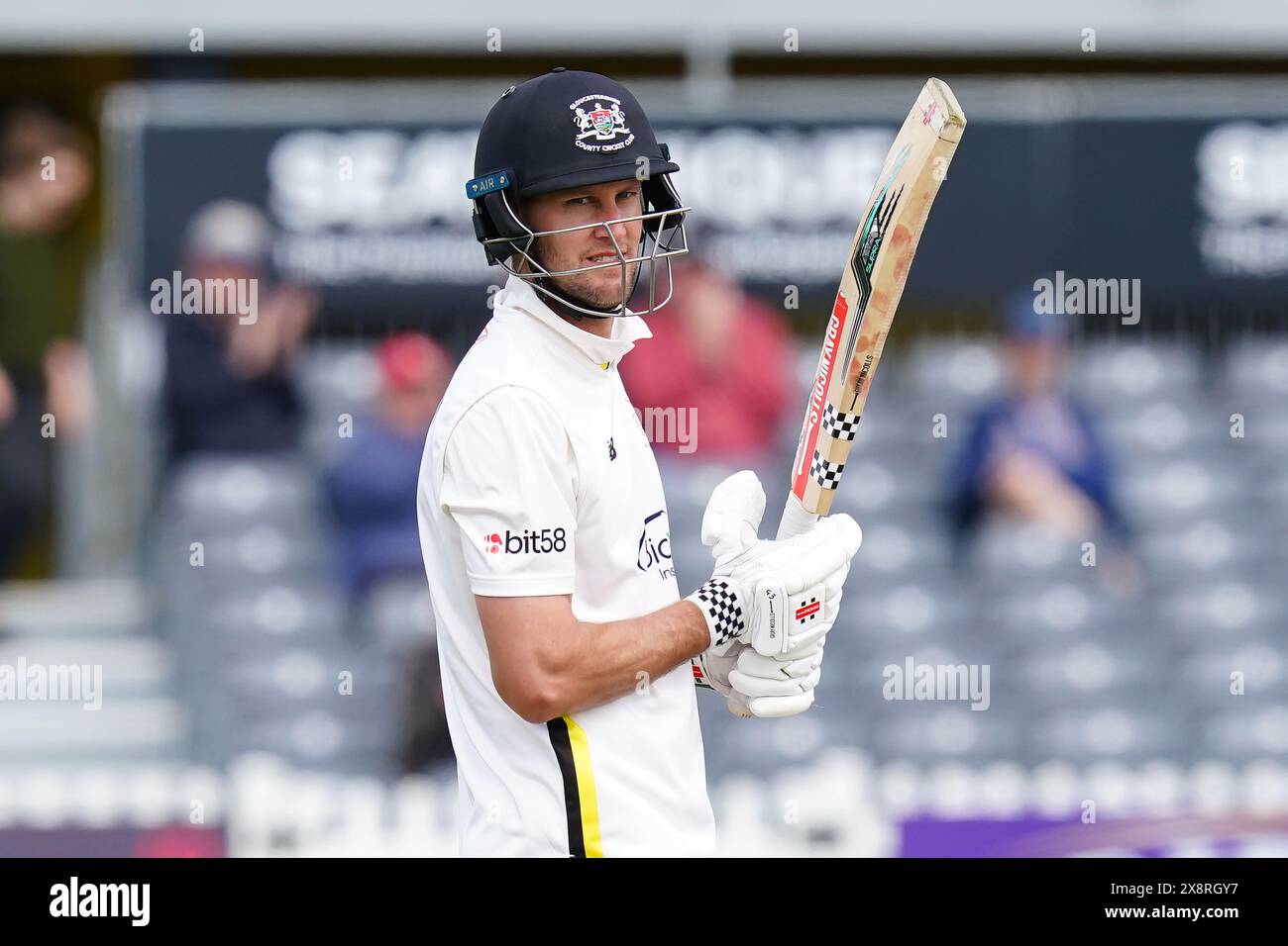 Bristol, UK, 27 May 2024. Gloucestershire's Beau Webster celebrates reaching a half century during the Vitality County Championship match between Gloucestershire and Derbyshire. Credit: Robbie Stephenson/Gloucestershire Cricket/Alamy Live News Stock Photo