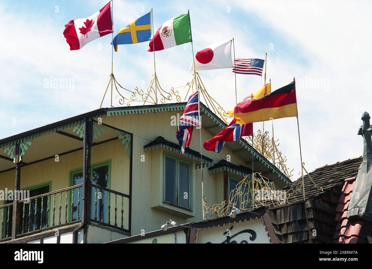 Colorado, U.S.A., approx. 1987. Exterior view of a local restaurant, with flags of different nations waving on top. Stock Photo
