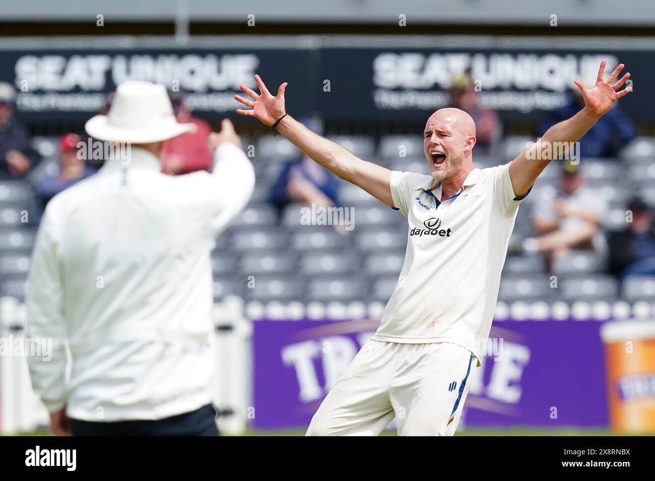 Bristol, UK, 27 May 2024. Derbyshire's Zak Chappell celebrates taking the wicket of Gloucestershire's Marchant de Lange during the Vitality County Championship match between Gloucestershire and Derbyshire. Credit: Robbie Stephenson/Gloucestershire Cricket/Alamy Live News Stock Photo