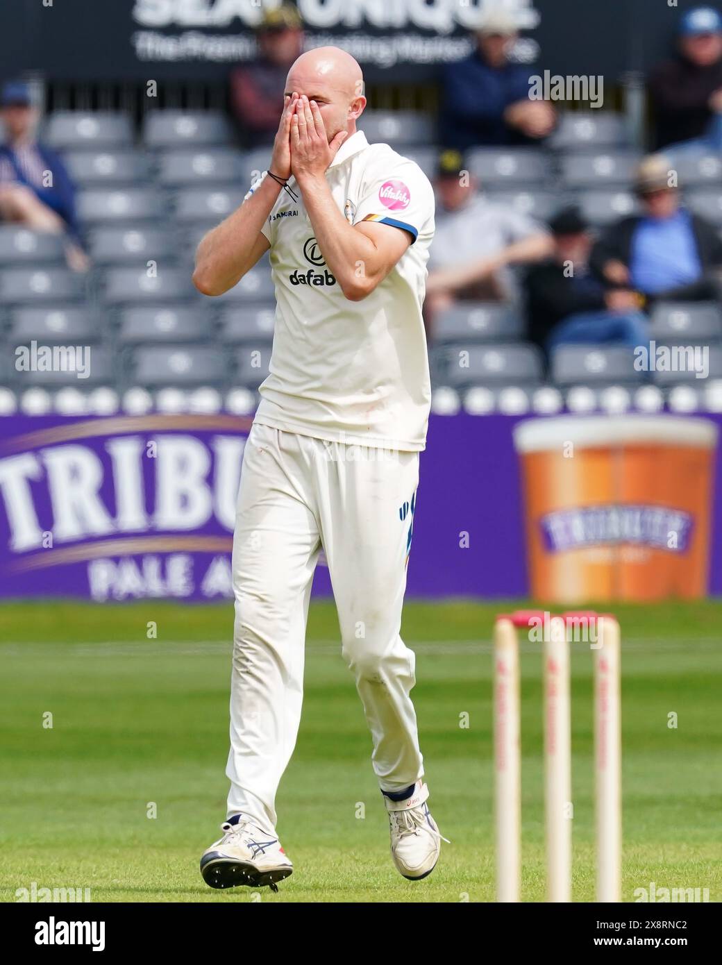 Bristol, UK, 27 May 2024. Derbyshire's Zak Chappell cuts a dejected figure during the Vitality County Championship match between Gloucestershire and Derbyshire. Credit: Robbie Stephenson/Gloucestershire Cricket/Alamy Live News Stock Photo