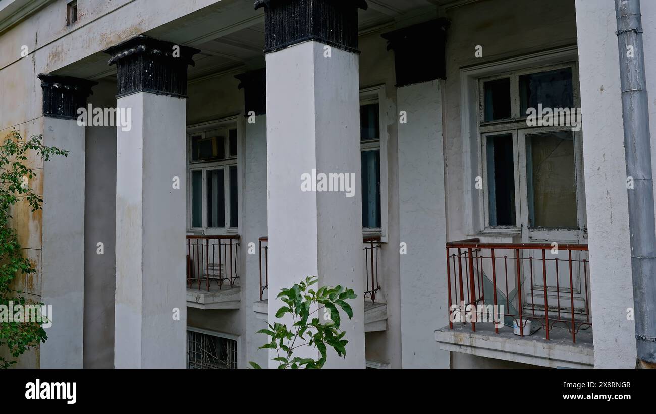 Abandoned 19th century palace with columns. Stock footage. Old manor house exterior. Stock Photo