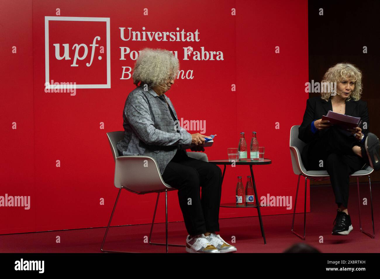 Barcelona, Spain. 27th May, 2024. Angela Davis gives a lecture at Pompeu Fabra University in Barcelona, where she spoke about racism, the Palestine conflict, and capitalism in society and universities. Angela Davis pronuncia una conferencia en la Universidad Pompeu Fabra de Barcelona, donde ha hablado sobre el racismo, el conflicto de Palestina y el capitalismo en la sociedad y las universidades. IN THE PIC:Angela Davis, monica tarribas News politics -Barcelona, Spain monday, may 27, 2024 (Photo by Eric Renom/LaPresse) Credit: LaPresse/Alamy Live News Stock Photo