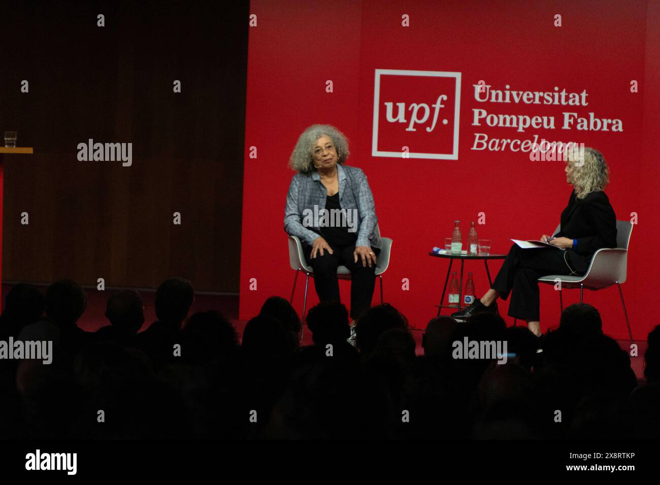 Barcelona, Spain. 27th May, 2024. Angela Davis gives a lecture at Pompeu Fabra University in Barcelona, where she spoke about racism, the Palestine conflict, and capitalism in society and universities. Angela Davis pronuncia una conferencia en la Universidad Pompeu Fabra de Barcelona, donde ha hablado sobre el racismo, el conflicto de Palestina y el capitalismo en la sociedad y las universidades. IN THE PIC:Angela Davis, monica tarribas News politics -Barcelona, Spain monday, may 27, 2024 (Photo by Eric Renom/LaPresse) Credit: LaPresse/Alamy Live News Stock Photo