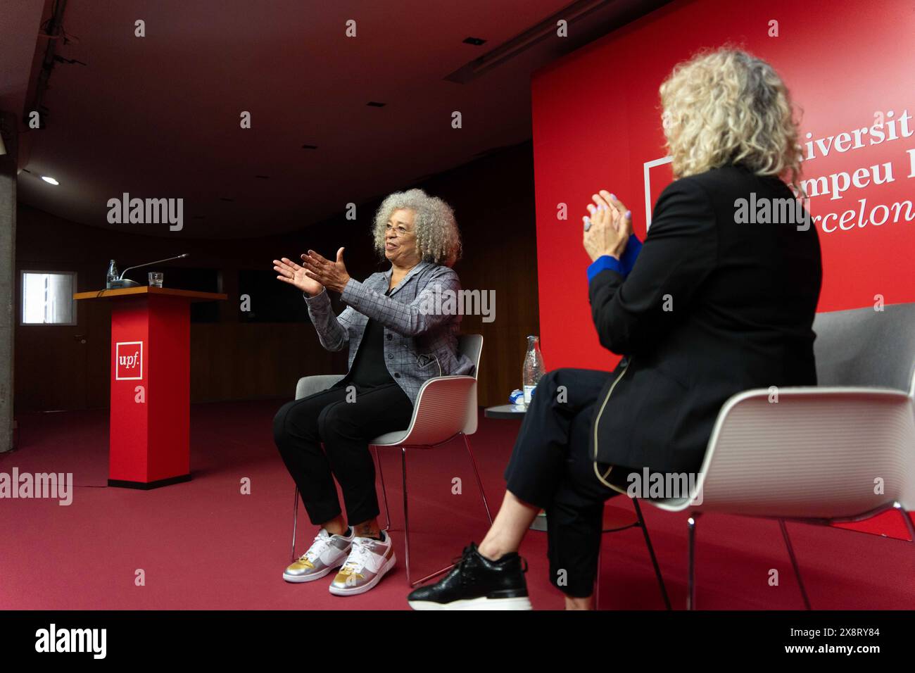 Barcelona, Spain. 27th May, 2024. Angela Davis gives a lecture at Pompeu Fabra University in Barcelona, where she spoke about racism, the Palestine conflict, and capitalism in society and universities. Angela Davis pronuncia una conferencia en la Universidad Pompeu Fabra de Barcelona, donde ha hablado sobre el racismo, el conflicto de Palestina y el capitalismo en la sociedad y las universidades. IN THE PIC:Angela Davis, monica tarribas News politics -Barcelona, Spain monday, may 27, 2024 (Photo by Eric Renom/LaPresse) Credit: LaPresse/Alamy Live News Stock Photo