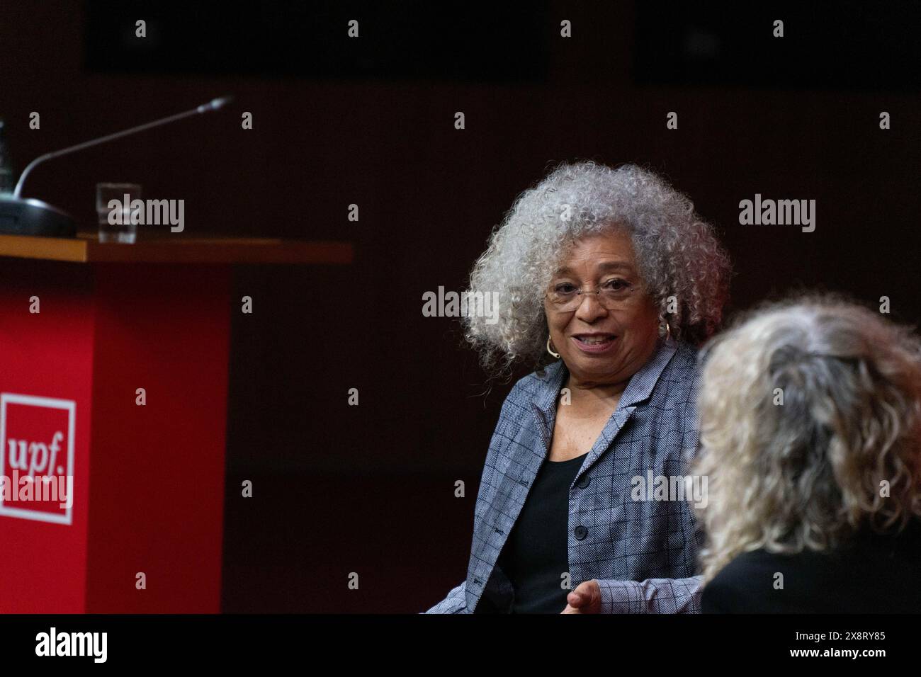 Barcelona, Spain. 27th May, 2024. Angela Davis gives a lecture at Pompeu Fabra University in Barcelona, where she spoke about racism, the Palestine conflict, and capitalism in society and universities. Angela Davis pronuncia una conferencia en la Universidad Pompeu Fabra de Barcelona, donde ha hablado sobre el racismo, el conflicto de Palestina y el capitalismo en la sociedad y las universidades. IN THE PIC:Angela Davis, monica tarribas News politics -Barcelona, Spain monday, may 27, 2024 (Photo by Eric Renom/LaPresse) Credit: LaPresse/Alamy Live News Stock Photo