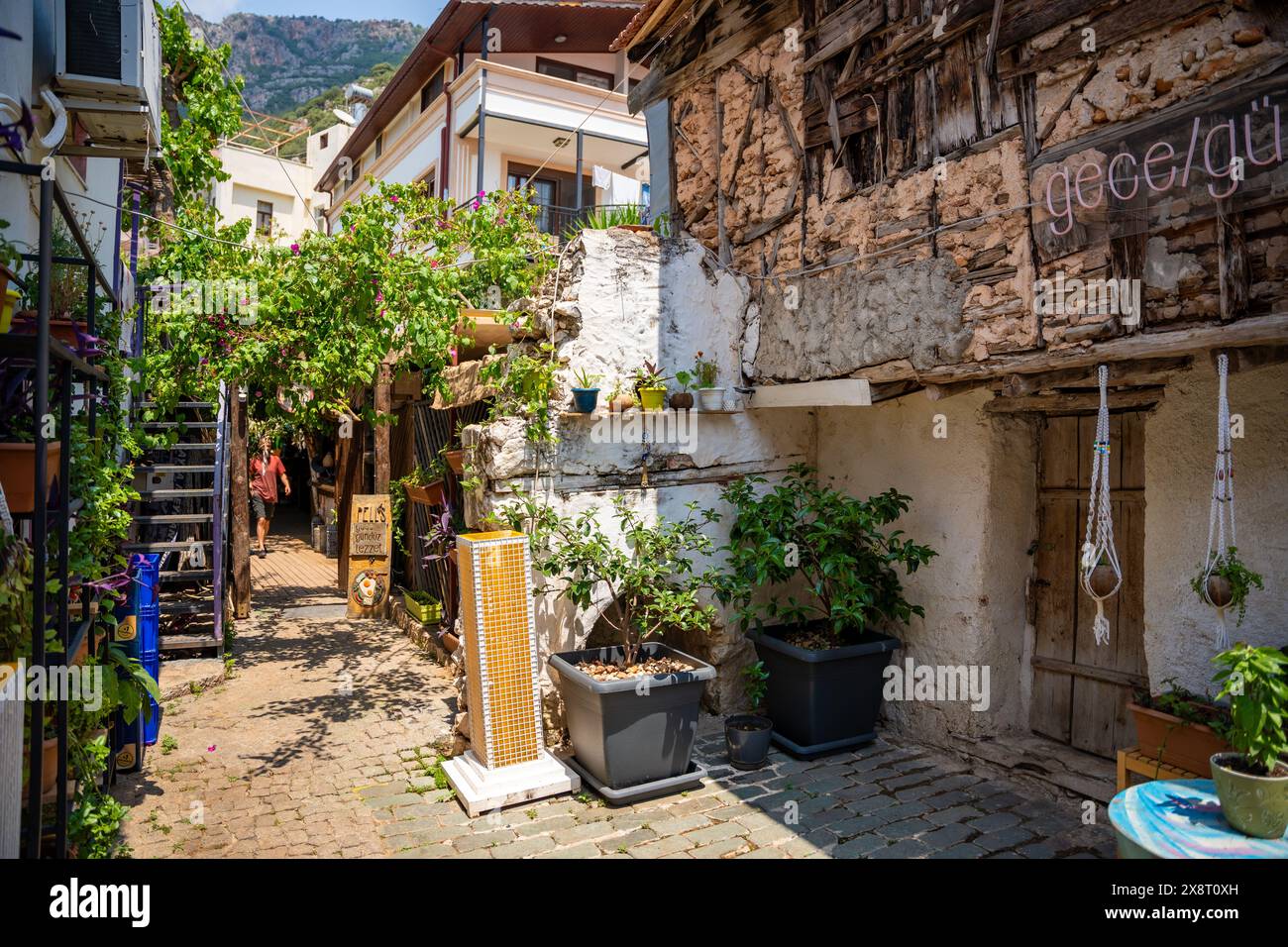 Kas, Turkey - May 12, 2024: Old street in Kas town with people and boutique shops in Turkey  Stock Photo