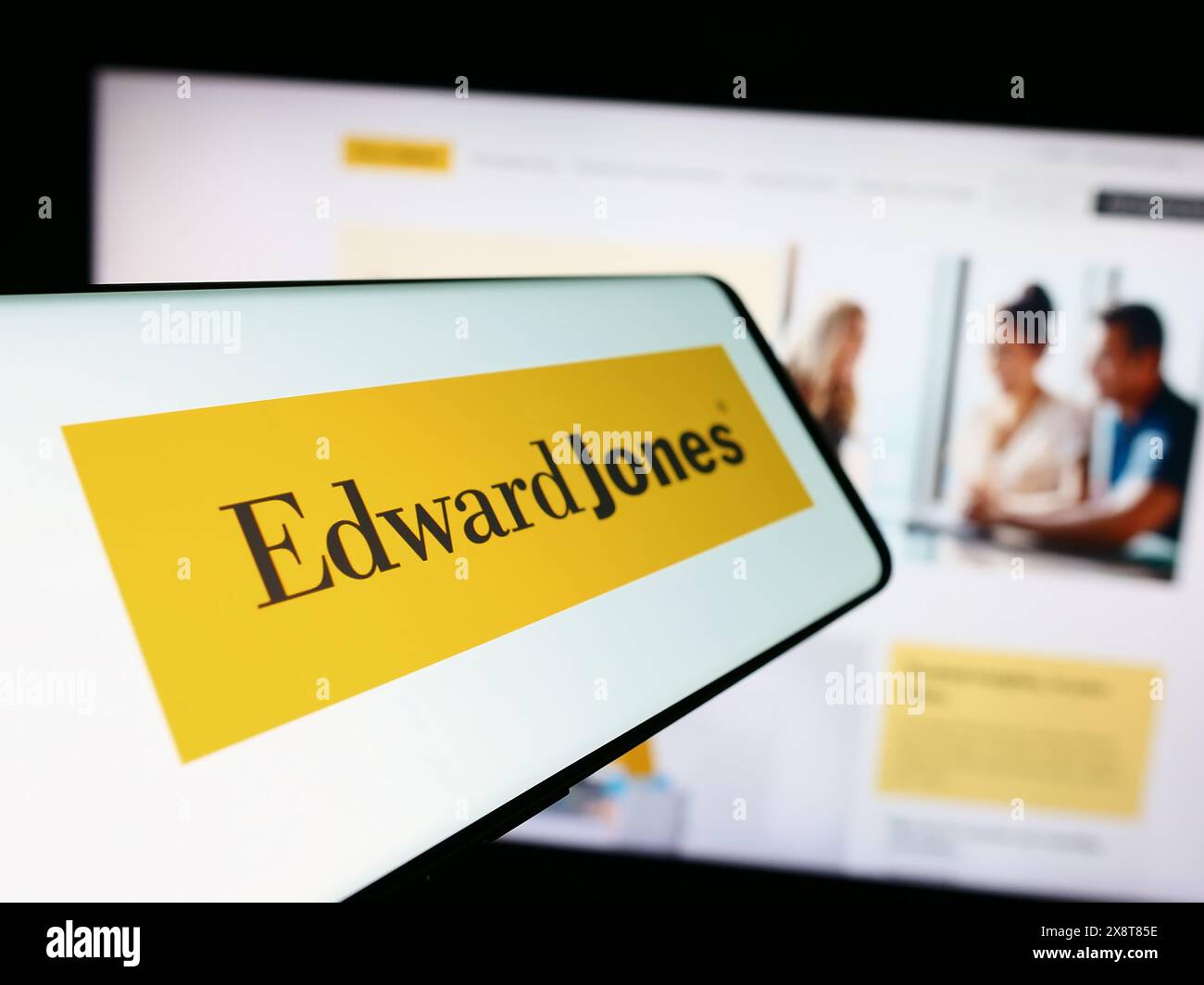 Mobile phone with logo of US financial services company Edward Jones