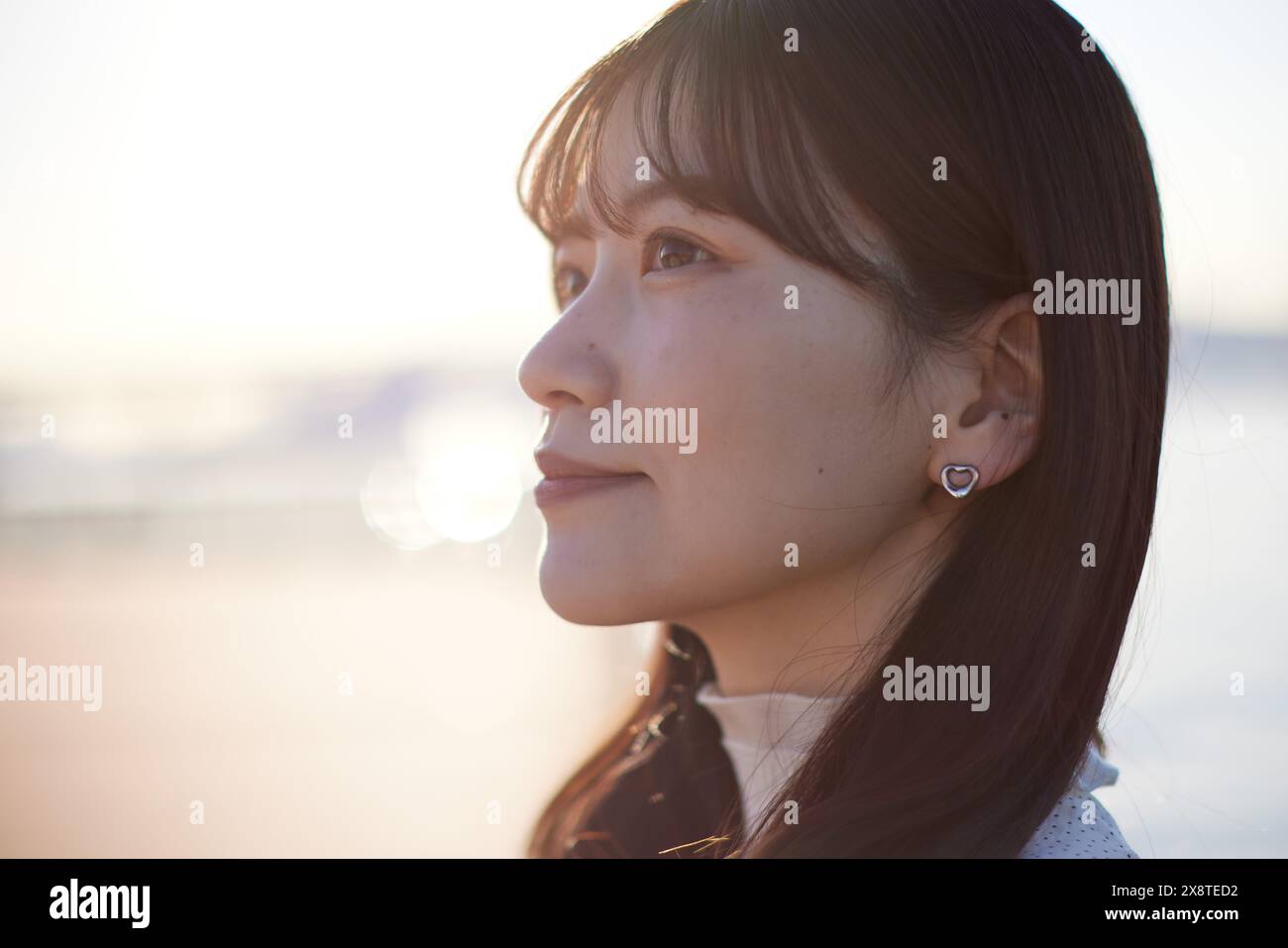 Japanese woman with long hair and a white dress Stock Photo - Alamy