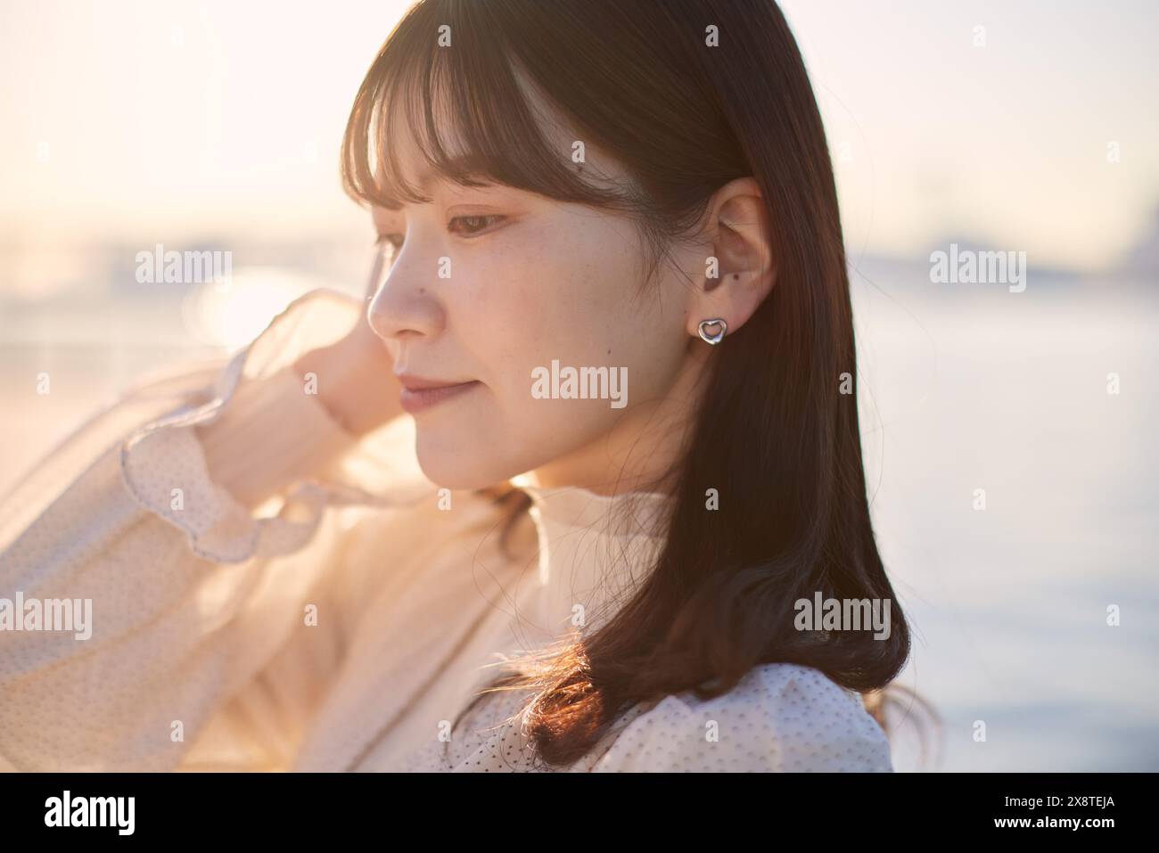 Japanese woman with long hair and a white dress Stock Photo - Alamy
