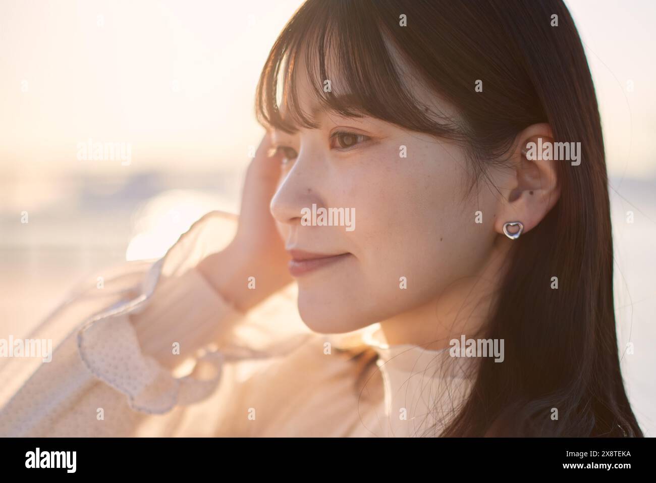Japanese woman with long hair and a white dress Stock Photo - Alamy