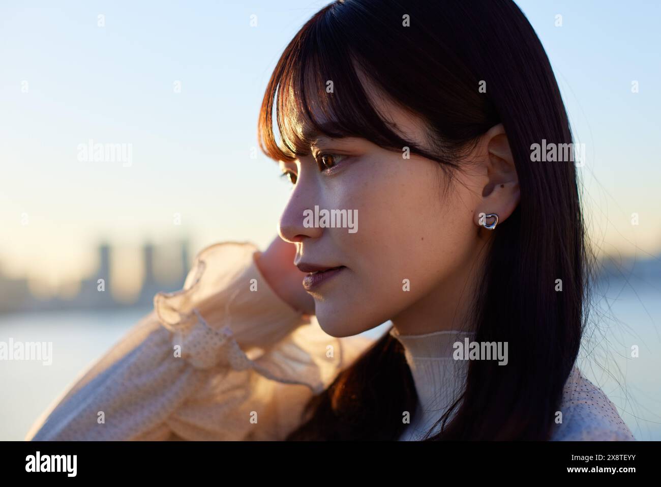 Japanese woman with long hair and a white dress Stock Photo - Alamy