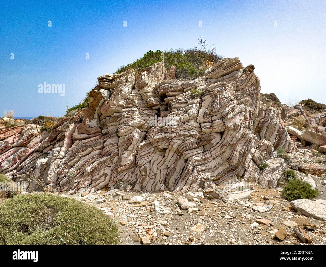 Agios Pavlos Rock with striking folded rock, Agios Pavlos, Crete, Greece Stock Photo