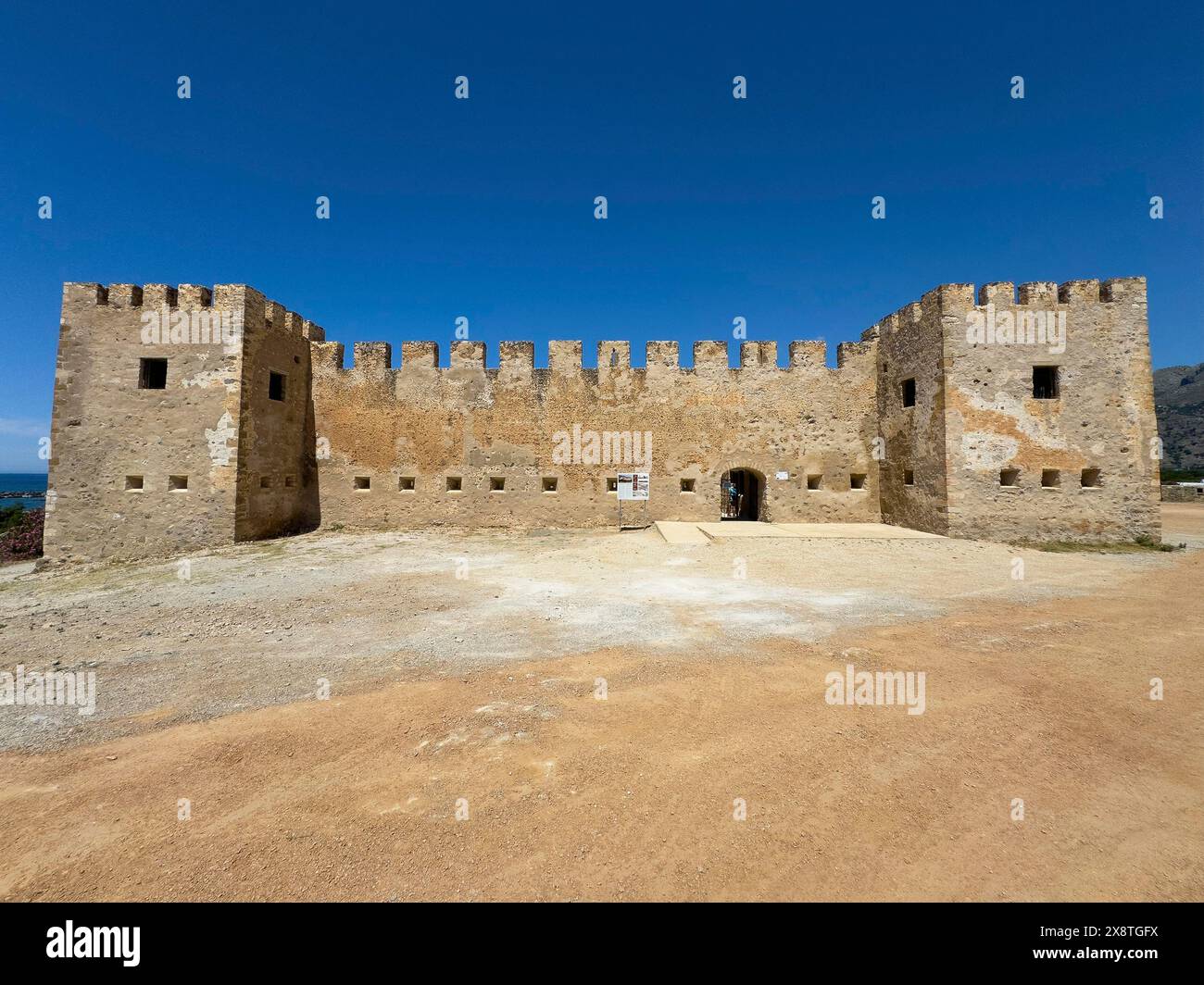 Exterior view with two corner towers walls battlements entrance of Fort Fortezza Fortetza Frangokastello built by Republic of Venice in 14th century Stock Photo