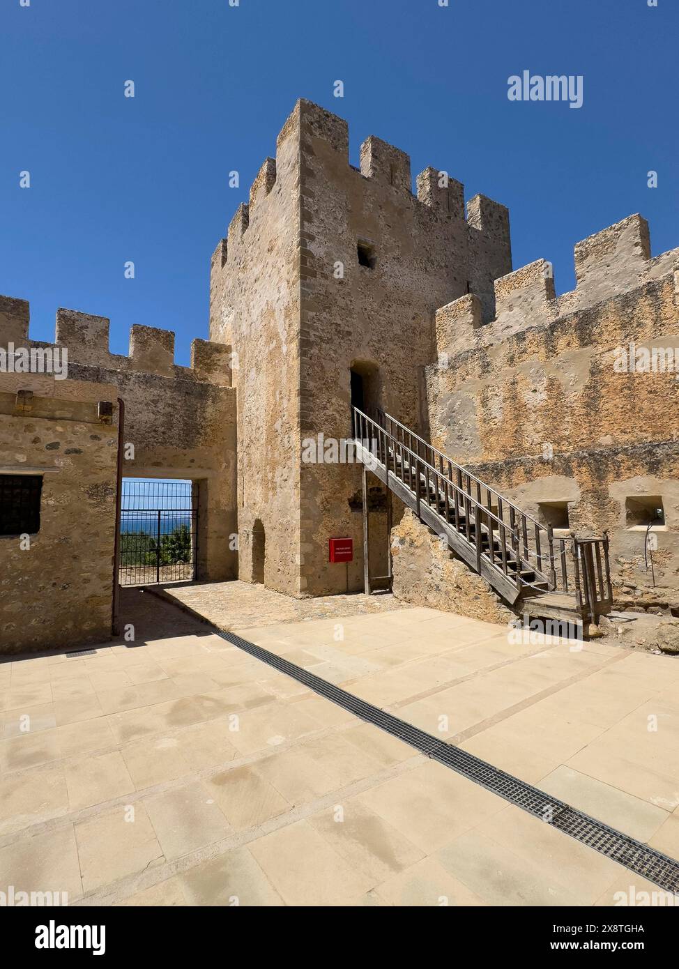 View from inner courtyard to corner tower with staircase entrance of Fort Fortezza Fortetza Frangokastello built by Republic of Venice in 14th Stock Photo
