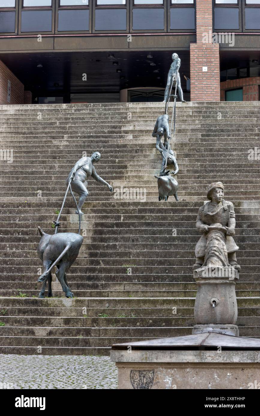 Group of figures and man with beer bottle by Karl-Henning Seemann in Gelbinger Gasse on the steps to the district administration office in the Stock Photo