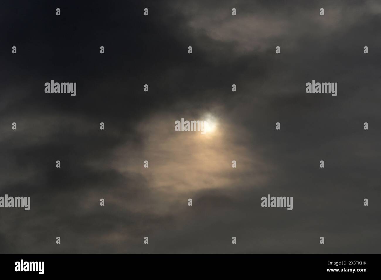 Sun shines through rain clouds hi-res stock photography and images - Alamy