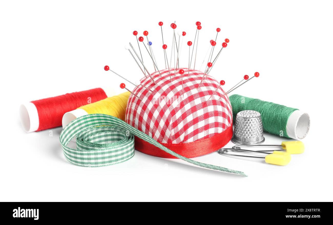 Sewing Ribbon Pin Checkered pincushion with sewing pins, spools of threads, ribbon and ...