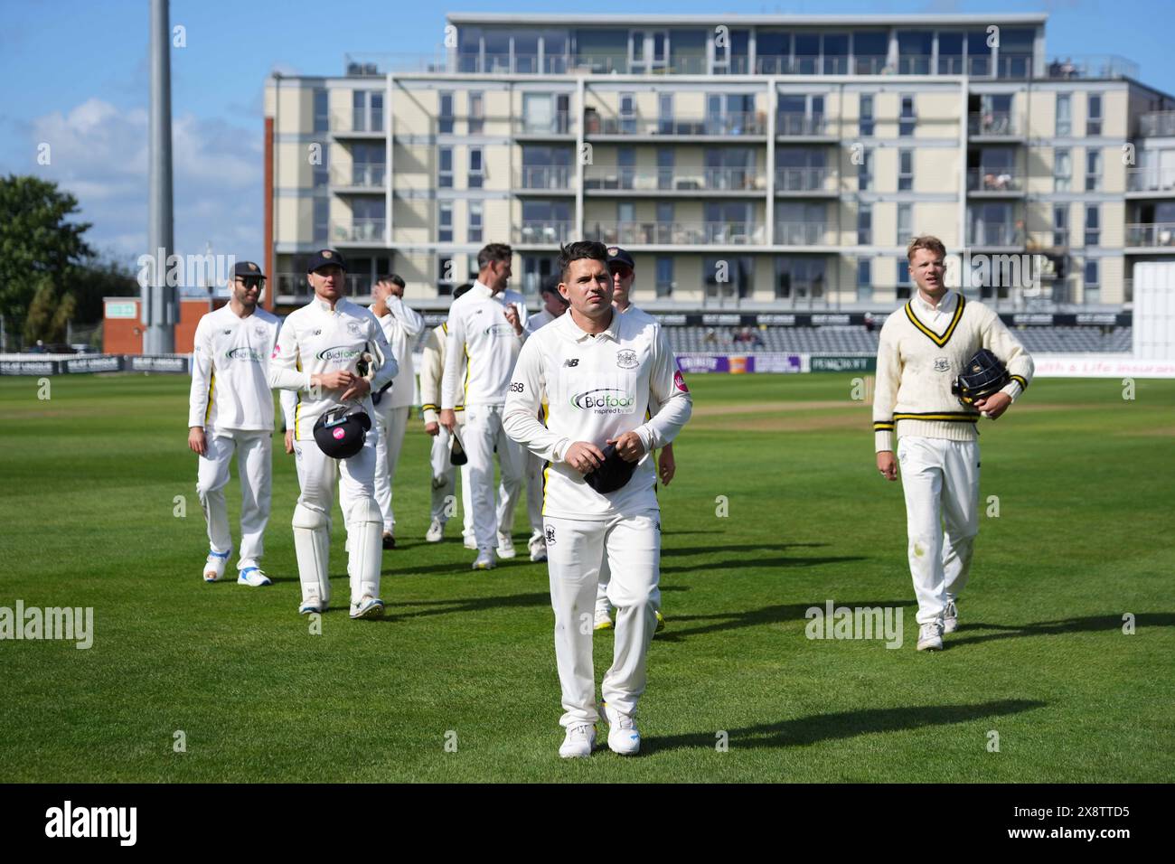 Bristol, UK, 27 May 2024. Gloucestershire's Graeme van Buuren leads the side off the field during the Vitality County Championship match between Gloucestershire and Derbyshire. Credit: Robbie Stephenson/Gloucestershire Cricket/Alamy Live News Stock Photo