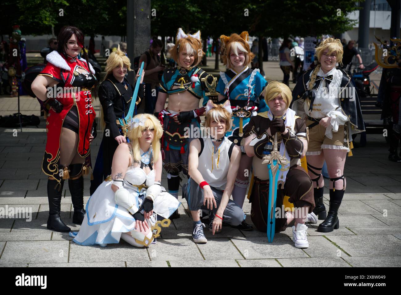 A group of male and female Cosplay people pose for photos at MCM Comic Con Stock Photo