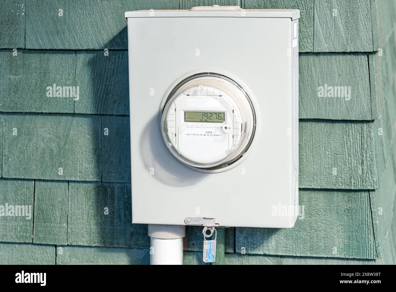 Close up of a smart electricity meter on a wooden wall Stock Photo