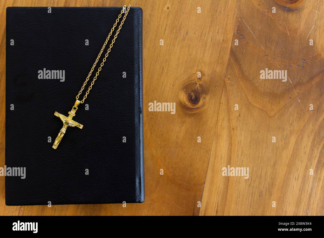 cross is placed on the Bible after prayer to God, which is religious ...