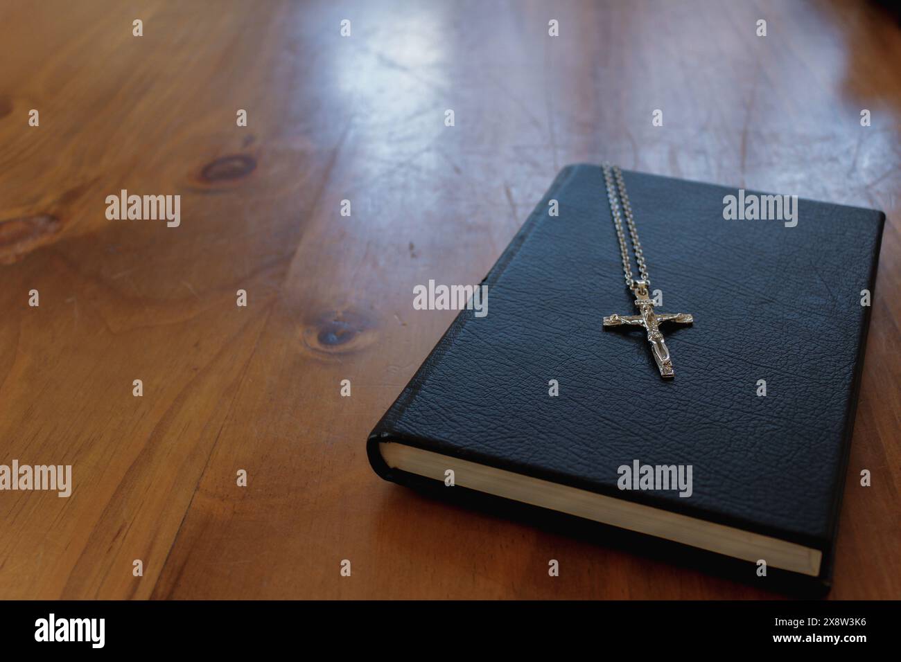 cross is placed on the Bible after prayer to God, which is religious ...