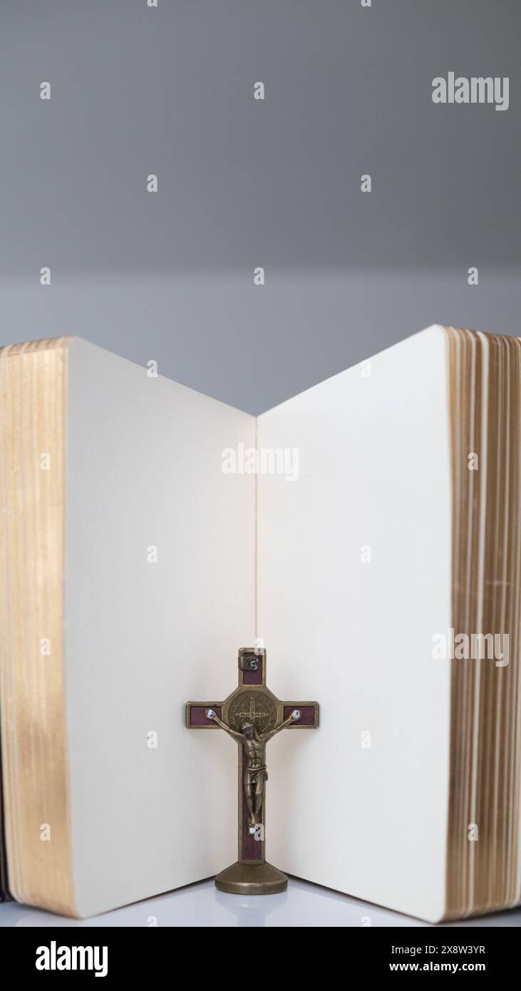 cross is placed on the Bible after prayer to God, which is religious ...