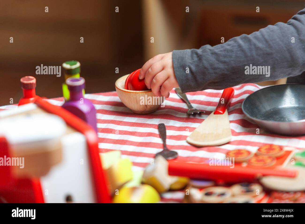 Children hands playing at cooking. Pretend play, cognitive, social and