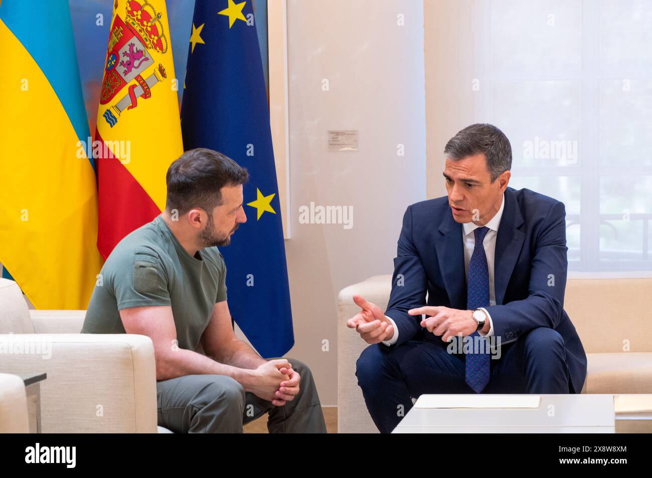 Madrid, Spain. 27th May, 2024. Ukrainian President Volodymyr Zelensky (left) speaks with Spanish Prime Minister Pedro Sanchez (right) at Moncloa Palace in Madrid. Both have signed a bilateral security agreement, which includes military supplies ranging from Patriot missiles to Leopard tanks, amounting to 1.129 billion euros. (Photo by Miguel Candela/SOPA Images/Sipa USA) Credit: Sipa USA/Alamy Live News Stock Photo