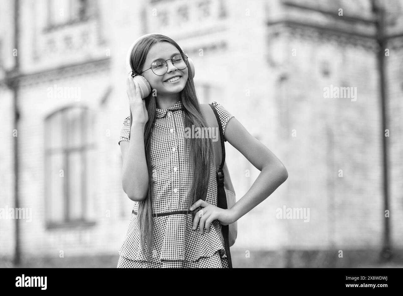 teen girl has education online. teen girl has education online in headphones. Stock Photo