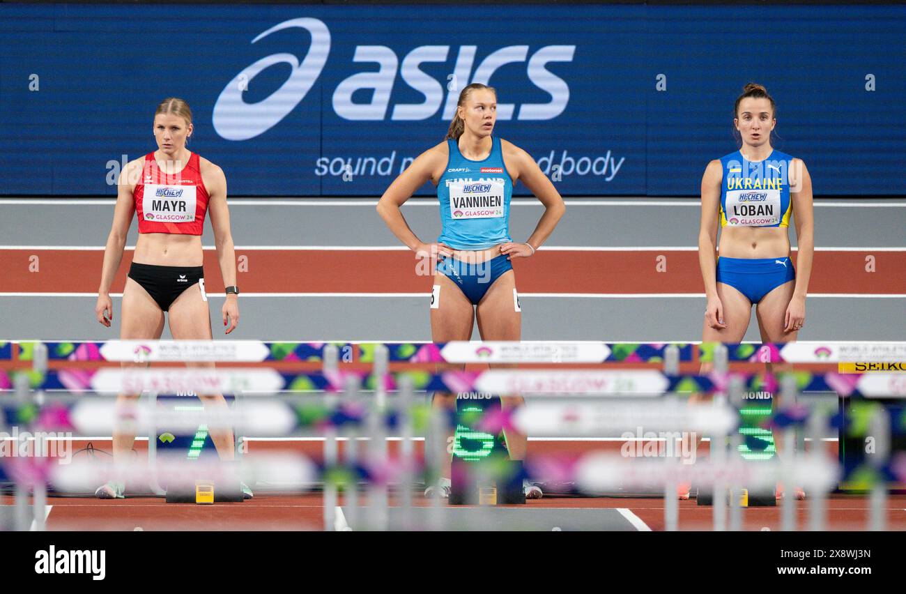 Verena Mayr of Austria, Saga Vanninen of Finland and Yuliya Loban of Ukraine competing in the 60m hurdle pentathlon at the World Athletics Indoor Cham Stock Photo