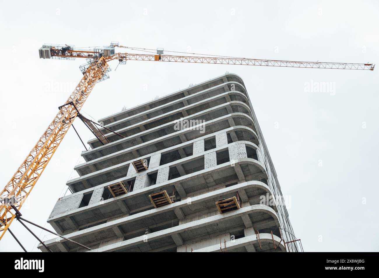 Construction crane for lifting loads on the building Stock Photo Alamy