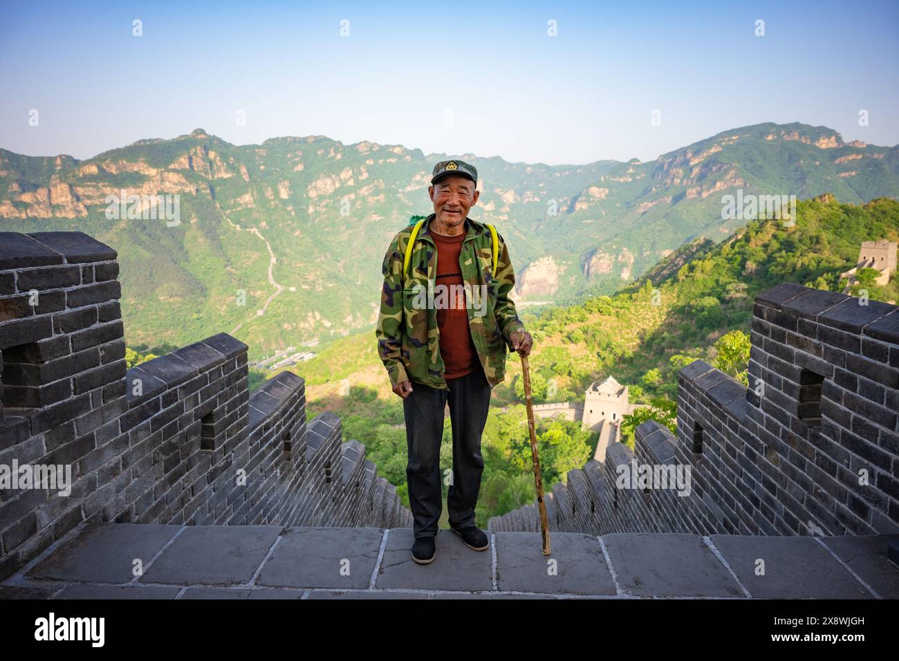 Local maintenance workers and "Great Wall Guardians" perform daily cleaning and structural inspections at the Huangyaguan section of the Great Wall. Stock Photo