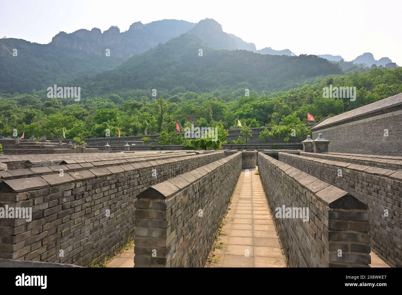 Local maintenance workers and "Great Wall Guardians" perform daily cleaning and structural inspections at the Huangyaguan section of the Great Wall. Stock Photo
