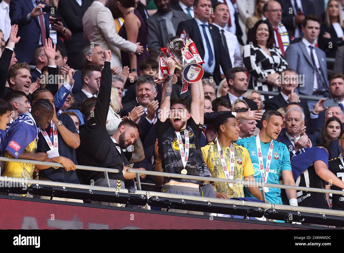 London, UK. 26th May, 2024. Ryan Manning of Southampton lifts the trophy during the Sky Bet Championship match at Wembley Stadium, London. Picture credit should read: Paul Terry/Sportimage Credit: Sportimage Ltd/Alamy Live News Stock Photo