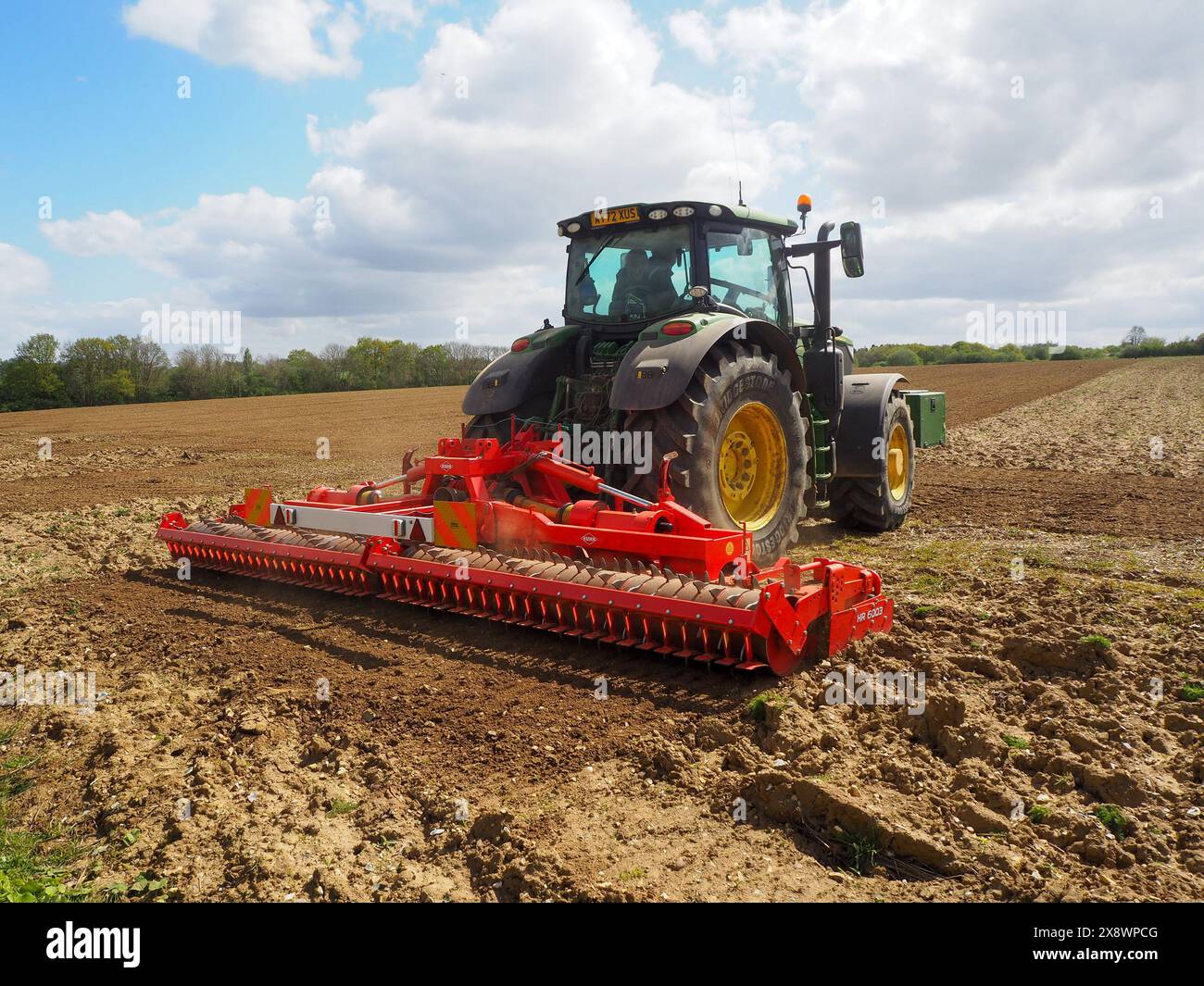 Harrrowing John deere 6r 215 power harrowing hi-res stock photography and images ...