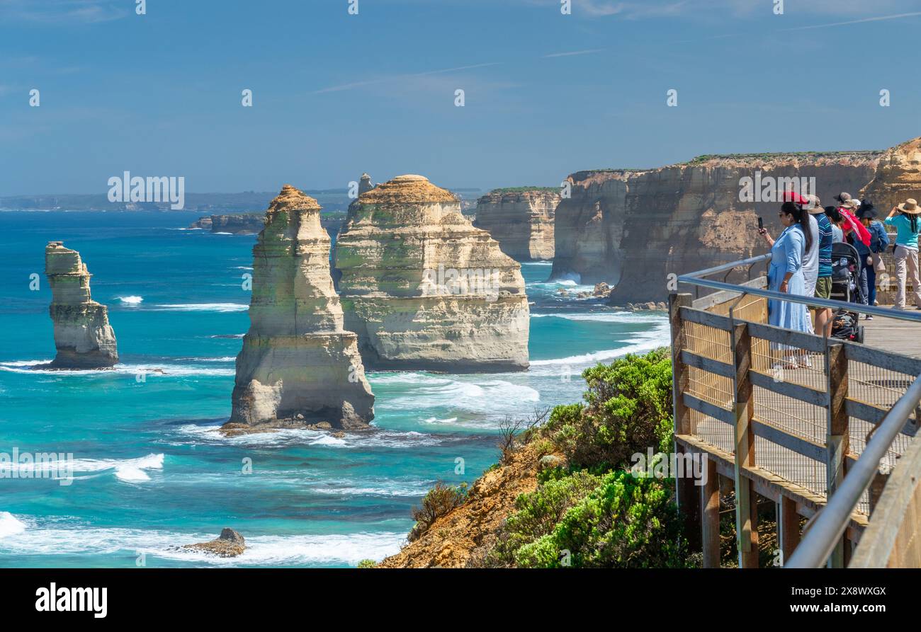 Sightseers and tourists at the 'Twelve Apostles' limestone sea stacks at Port Campbell National Park on the Great Ocean Road in Victoria, Australia. Stock Photo