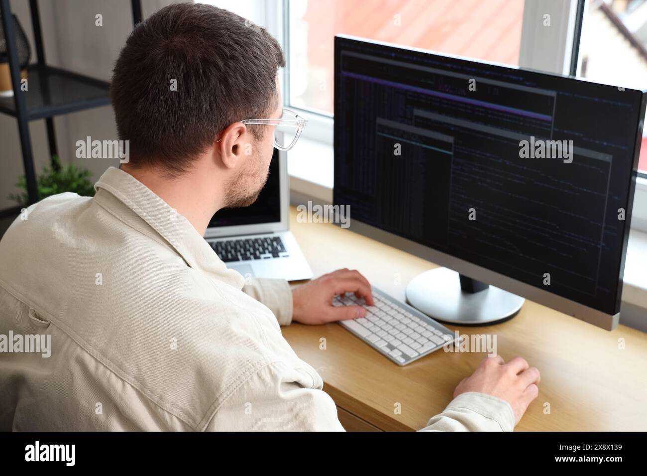 Focused male programmer working in office Stock Photo