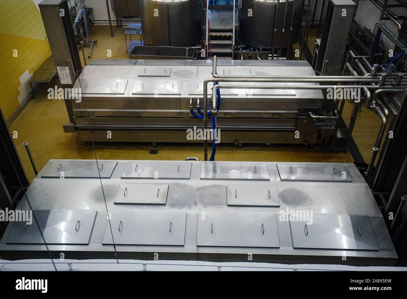 Modern cheese factory, stainless steel milk processing tanks. Stock Photo