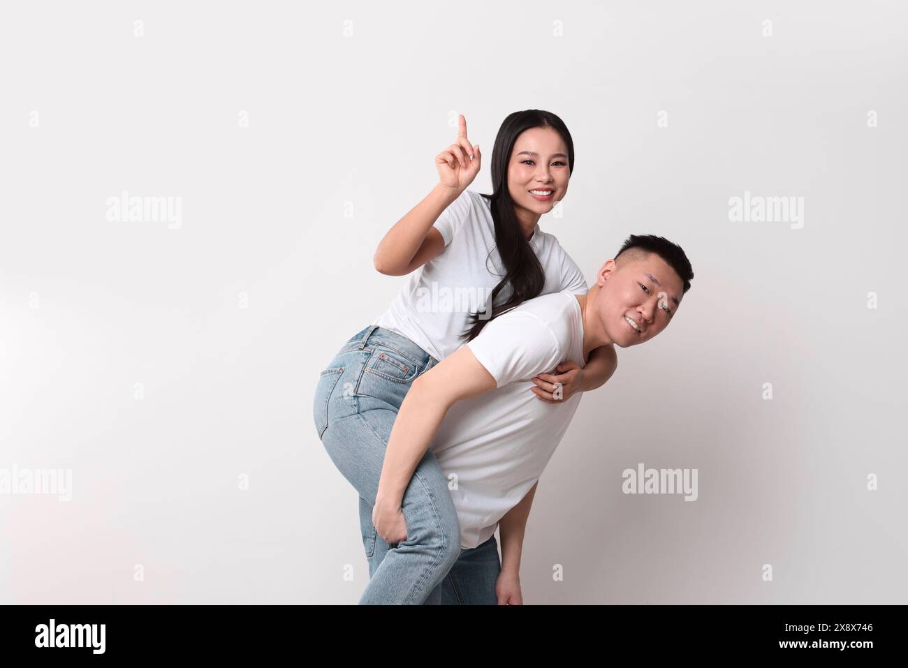 Portrait of happy couple on white background Stock Photo - Alamy
