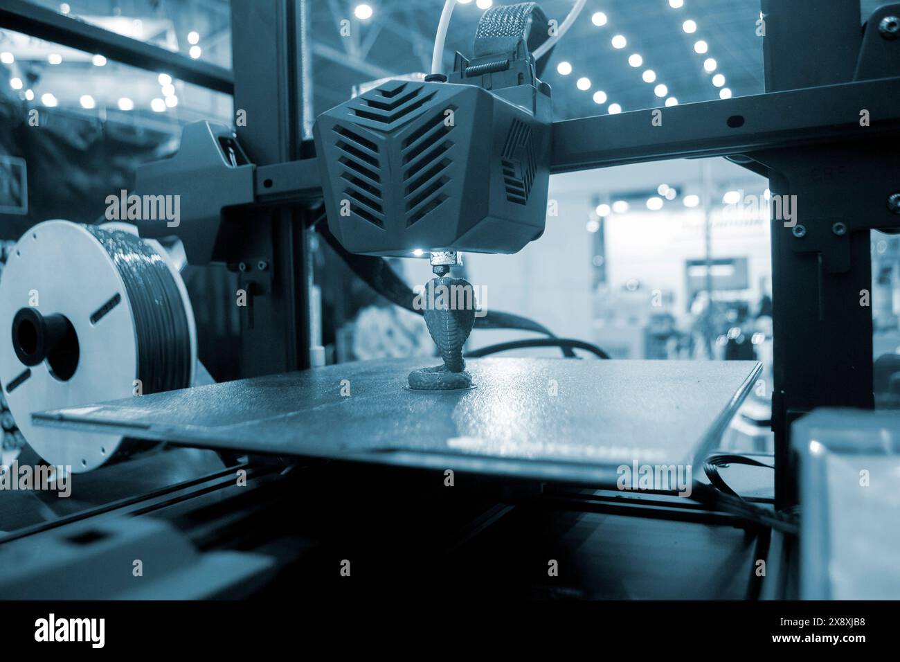 3D printer working close-up. 3D printer prints model from molten ...