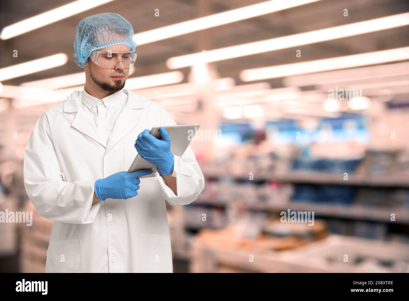 Food quality control specialist examining products in supermarket Stock ...