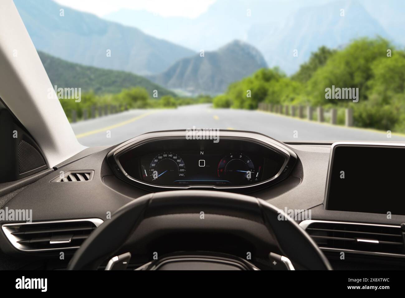 Dashboard with speedometer behind steering wheel inside car Stock Photo ...
