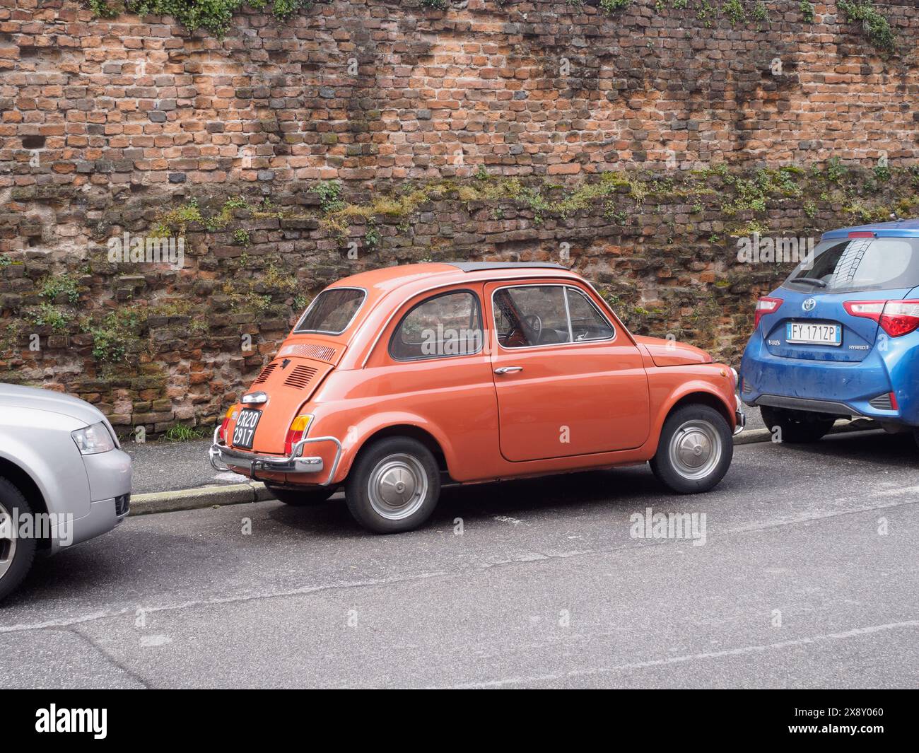 Cremona, Italy - May 15th 2024 Classic orange vintage italian Fiat 500 ...