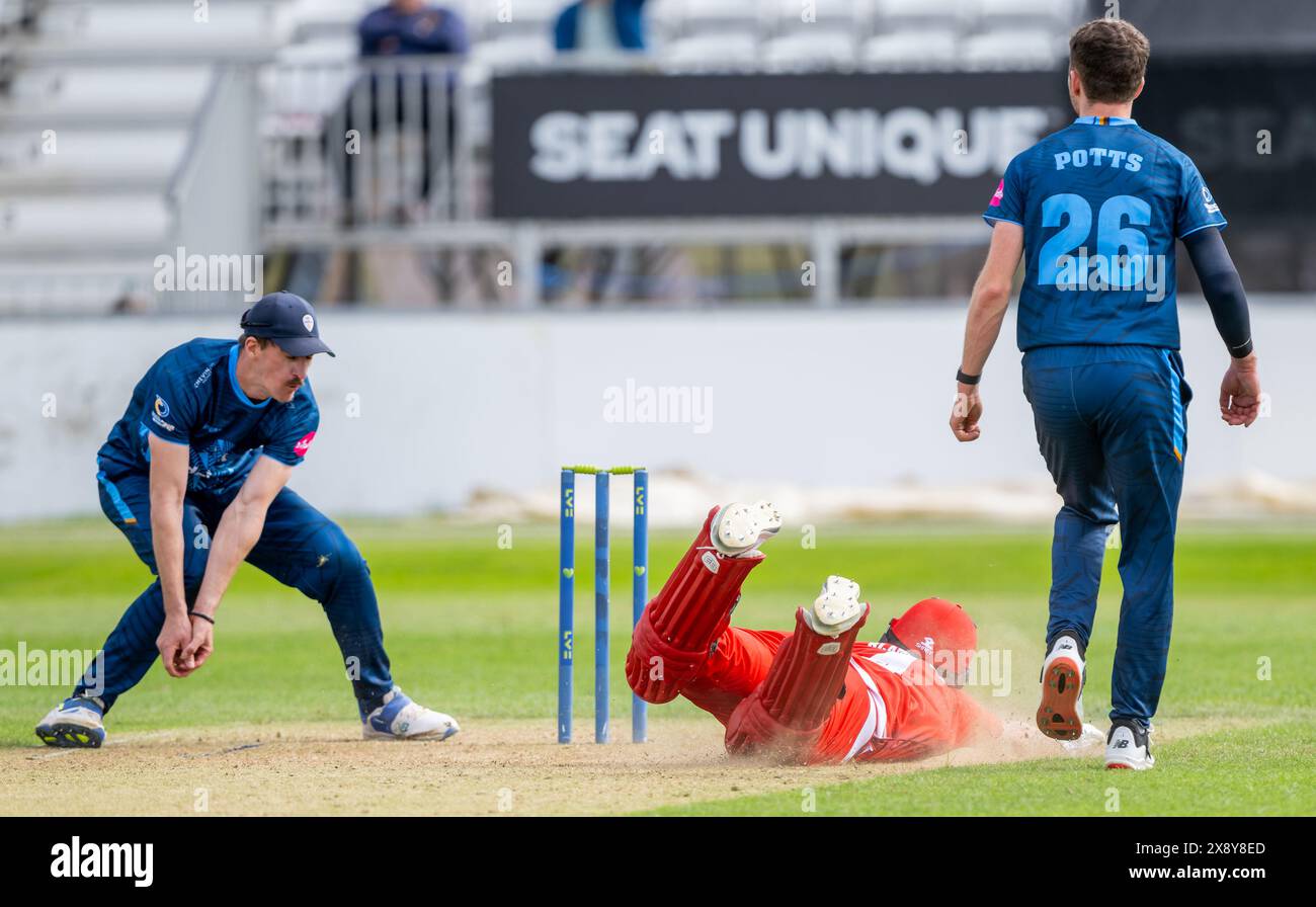 Lancashires Jack Blatherwick dives to make the winning run during in a Second XI T20 match between Derbyshire and Lancashire. Stock Photo